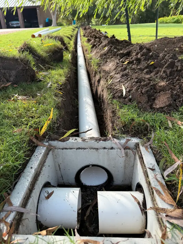 Catch basin and drain pipe connected in an open trench — Drainage Solutions