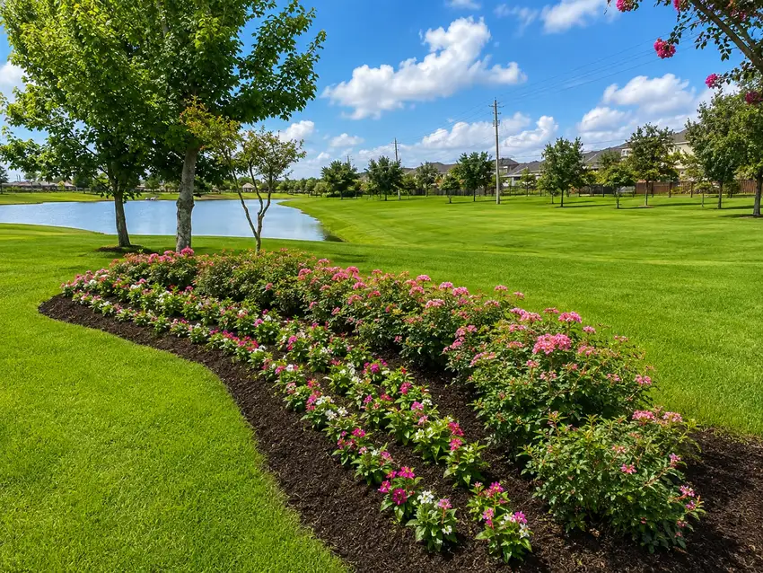 Lakeside community bed with pink and white seasonal color — HOA & Commercial Properties