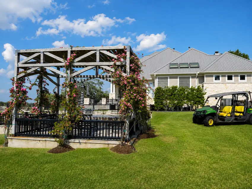 Timber pergola and rose plantings at a ranch property — Ranch Services